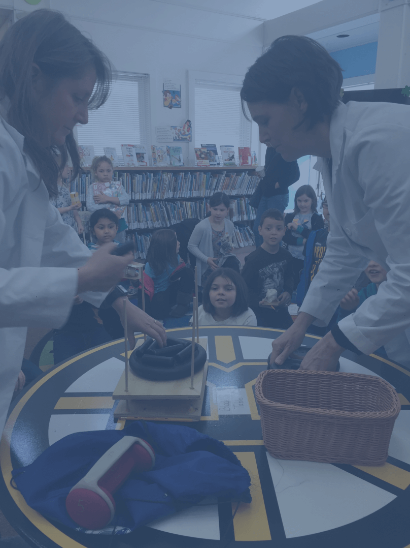 Dr. Liz and Dr. Pearl teaching in front of students
